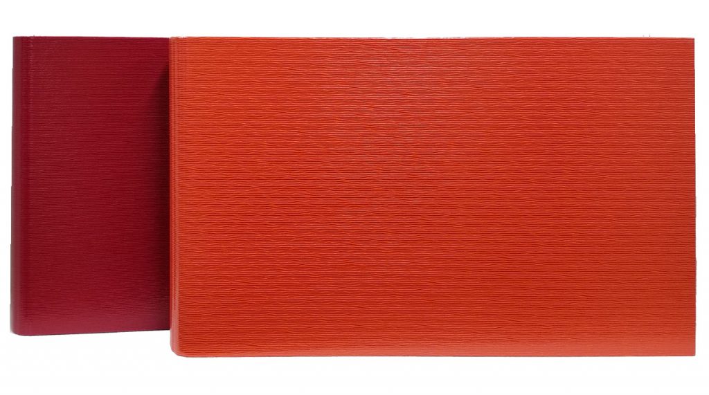 Tabloid 3-Ring Binders in Red and Orange.